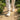 Summit barefoot hiking shoe for men in off white cream, worn walking a gravel garden path