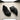Wave barefoot sneaker in black, top down view of the pair on a concrete floor