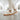 Grove barefoot sneaker in off white cream with gum sole, worn walking a bright gallery