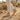 Grove barefoot sneaker for men in tan with gum sole, worn walking a desert trail