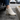 Summit barefoot hiking shoe in cream beige, worn stepping out of a car