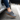 Anchor barefoot sneaker in charcoal grey worn stepping out of a car