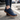 Grove barefoot sneaker in navy, worn stepping out of a car onto a city street