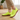 Stride barefoot sneaker in neon yellow knit with gum sole, worn on a wood floor