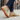 Pulse barefoot sneaker for men in sand tan with gum sole, worn on a city sidewalk, three quarter view