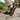 Sage barefoot sneaker in black tartan worn on stone, view of the gum tread