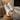 Pulse barefoot sneaker for men in white with gum sole, worn with feet up by a fireplace, top view of the low profile lace up