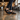 Loafers barefoot slip on shoe in black worn walking through a cafe