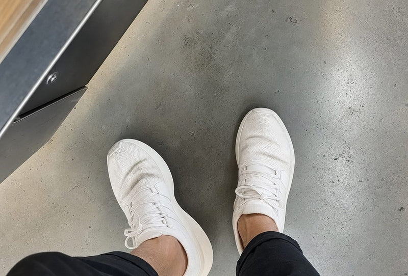 Toes pressed together inside a tapered shoe