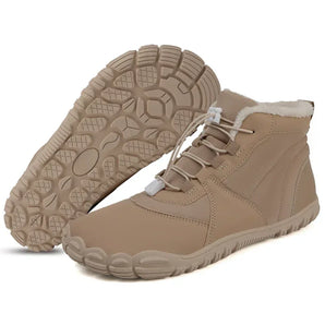 Emberfield barefoot winter boot in taupe beige, studio pair showing the wide toe box and lugged sole