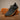 Pulse barefoot sneaker in black with gum sole, studio pair on wood, side view and flower pattern gum tread