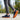 Grove barefoot sneaker for men in navy with gum sole, three quarter view worn in a park