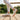 Grove barefoot sneaker in cream, worn walking on a wooden deck showing the gum sole