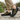 Trailblazer barefoot hiking shoe in black with yellow, worn as a pair on a stone path, three quarter view