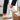 Terra barefoot trainer for men in white, worn climbing wooden stairs indoors, side view