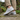 Anchor barefoot sneaker in light grey worn on a stone garden path for men