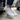 Anchor barefoot sneaker in light grey worn stepping out of a car