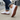 Stride barefoot sneaker for men in white knit with gum sole, worn on a sidewalk with tread visible