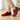 Stride barefoot sneaker in dark red knit with brown sole, side view worn on a wood floor