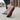Stride barefoot sneaker in gray heather knit with gum sole, worn walking a sidewalk