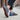 Stride barefoot sneaker in blue knit with gum sole, worn on a sidewalk with tread visible