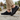 Sage barefoot sneaker in all black worn on stone, view of the black sole tread