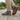Sage barefoot sneaker in grey plaid worn on stone, view of the gum sole tread