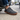 Sage barefoot sneaker in grey plaid worn stepping out of a car for men
