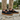 Loafers barefoot slip on shoe in black worn standing on a stone patio
