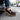 Loafers barefoot slip on shoe in black worn stepping out of a car