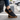 Loafers barefoot slip on shoe in black worn stepping out of a car