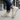 Breeze barefoot sneaker in cream worn on a city street, rear view of the sole