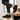 Wave barefoot sneaker in black, worn climbing wooden stairs showing the zigzag tread sole