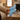 Summit barefoot hiking shoe for men in sky blue, pair worn with feet up on a wood table