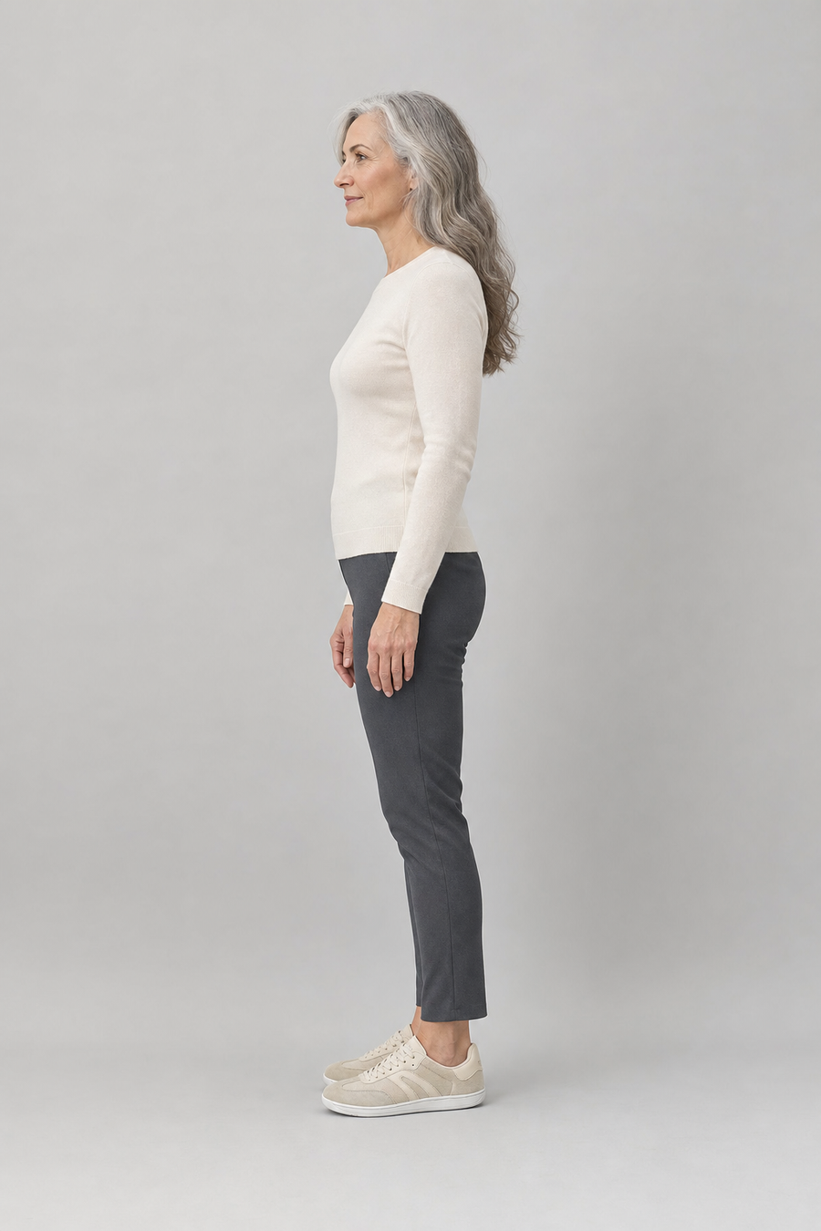 A woman standing in the Rove shoes, side view showing her hips, knees, ankles and the ball of her foot