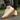 Ease barefoot slip on shoe for men in cream, worn side view walking on paving with gum sole