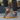 Ease barefoot slip on shoe for men in grey, worn side view standing on paving