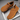 Ease barefoot slip on shoe in caramel brown, top down view of the pair and toggle drawstring