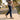 Man walking on a neighborhood sidewalk in Anchor barefoot sneakers